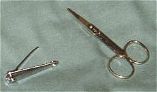 Fingernail clippers (left) and nosehair scissors (right).